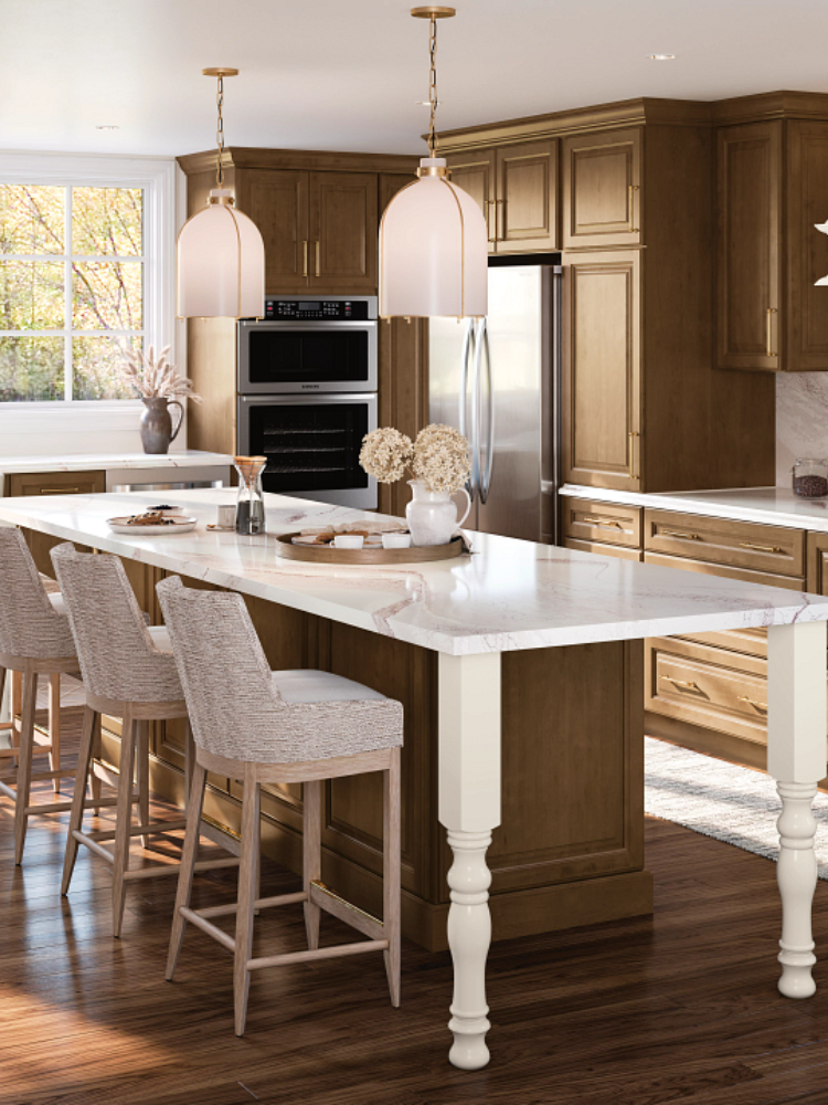Kitchen with dark cabinetry and extended quartz countertop
